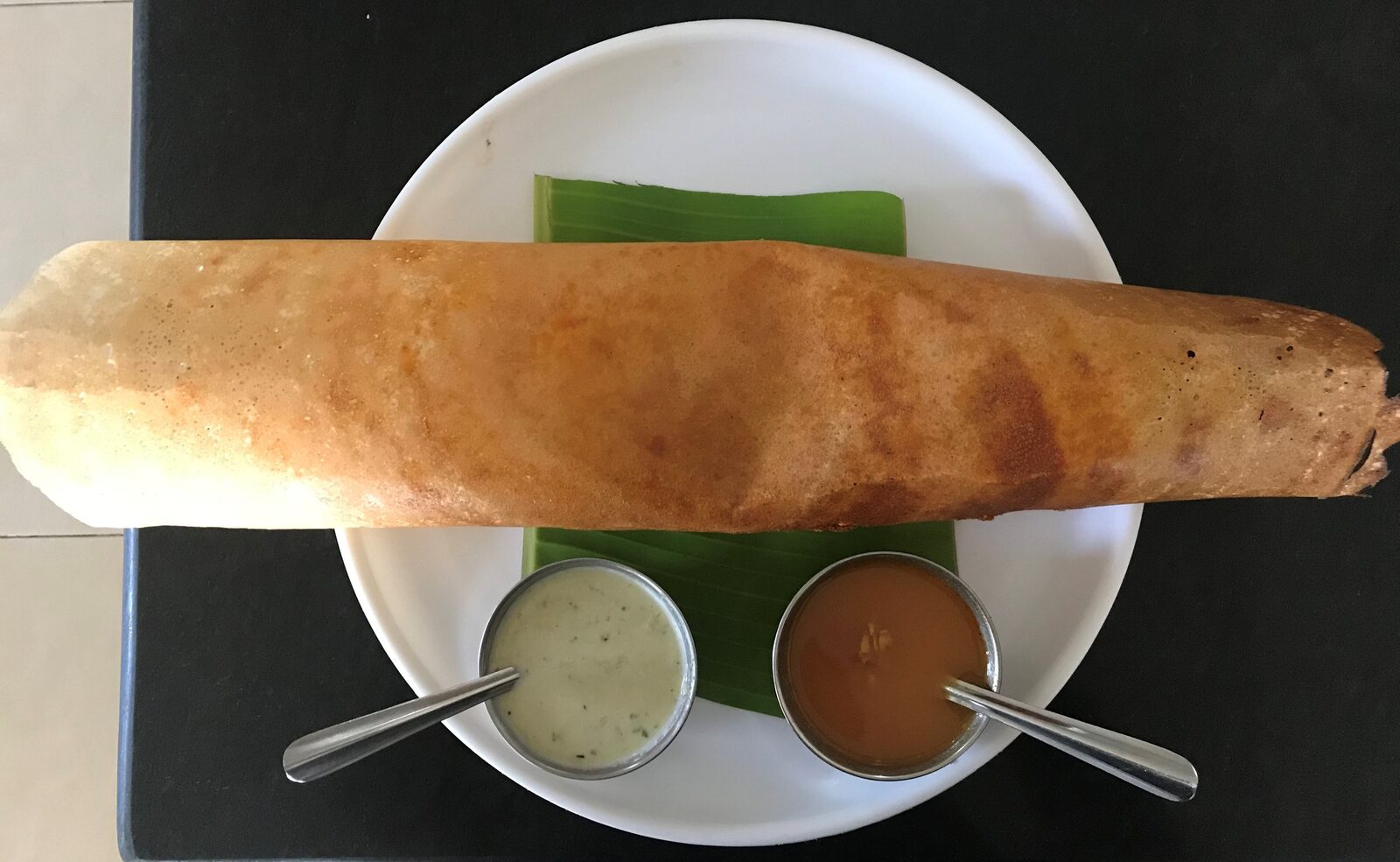 Crisp South Indian masala dosa served with sambar and coconut chutney