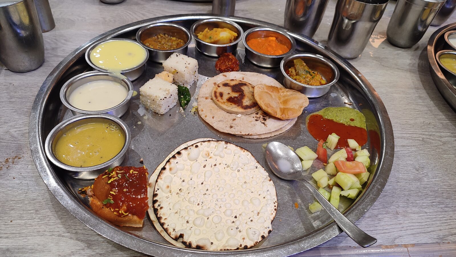 Bhakti Special Thali with dal, kadhi, two sabzis, rice, roti, salad and dessert
